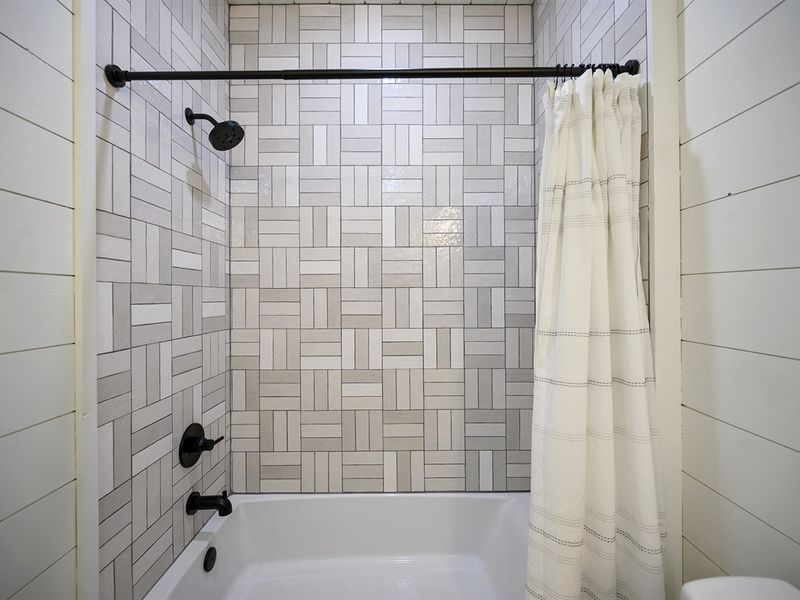 Dive into a refreshing shower experience in this bright and inviting oasis.