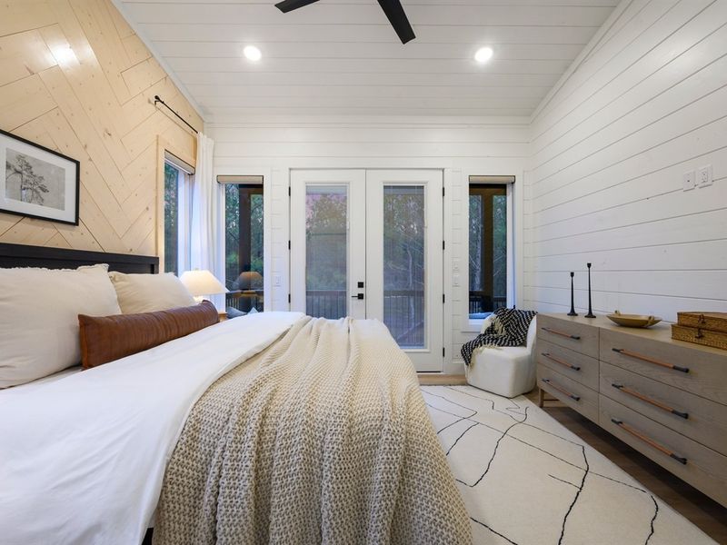 A stylish sliding barn door leads to the spa-inspired ensuite bathroom.