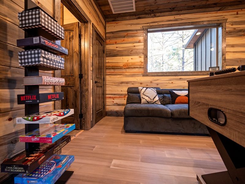 Spend rainy afternoons playing games, laughing with friends, and relaxing in this cozy cabin hangout space.