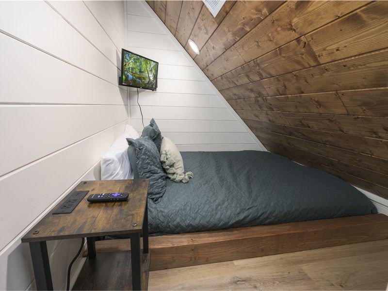 A second private nook offering a cozy queen bed and rustic elegance. The perfect hideaway for guests looking for a peaceful retreat.