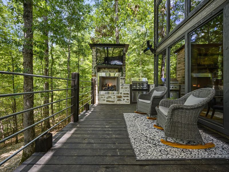 Take in the breathtaking views from our back deck overlooking the natural pond. With lush trees and serene surroundings, it's the perfect spot to unwind and connect with nature.