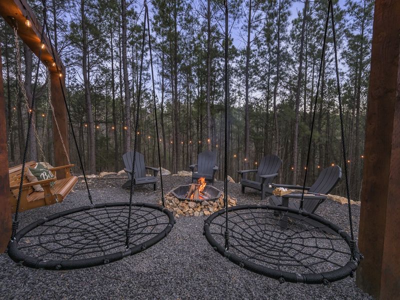 Swing into the night as the fire crackles nearby.