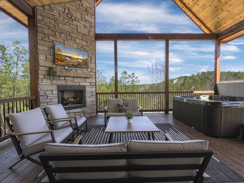 A cozy outdoor fireplace makes for the perfect evening ambiance.