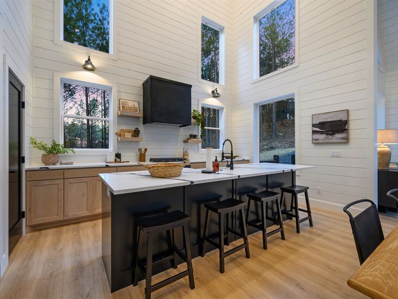 A spacious island with seating makes it easy to gather, prep meals, or enjoy morning coffee together.