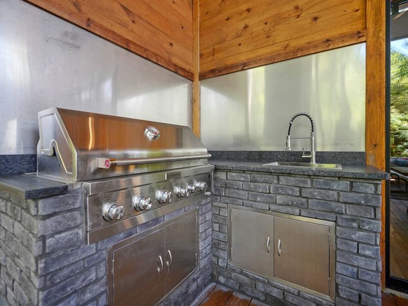 Grill up some delicious meats and veggies in the outdoor kitchen.