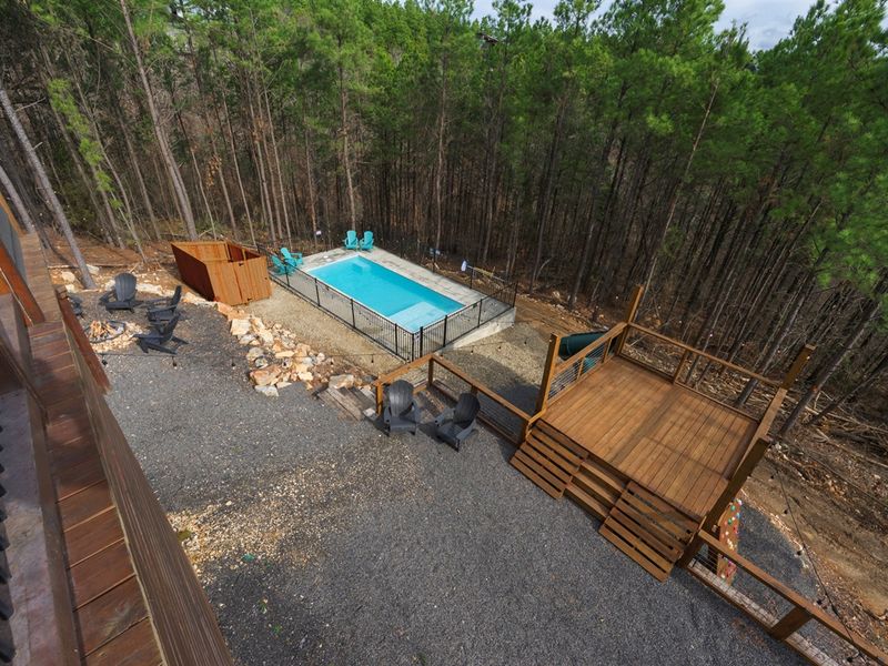 Multiple levels of outdoor living—pool, fire pit, and elevated deck views