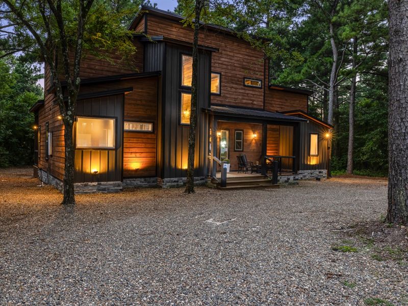 Spend your evenings under the trees, listening to nature from the deck before retreating inside to cozy modern comfort.