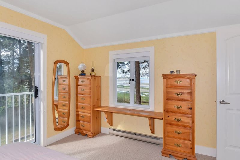 Master bedroom with step out balcony on second floor. 