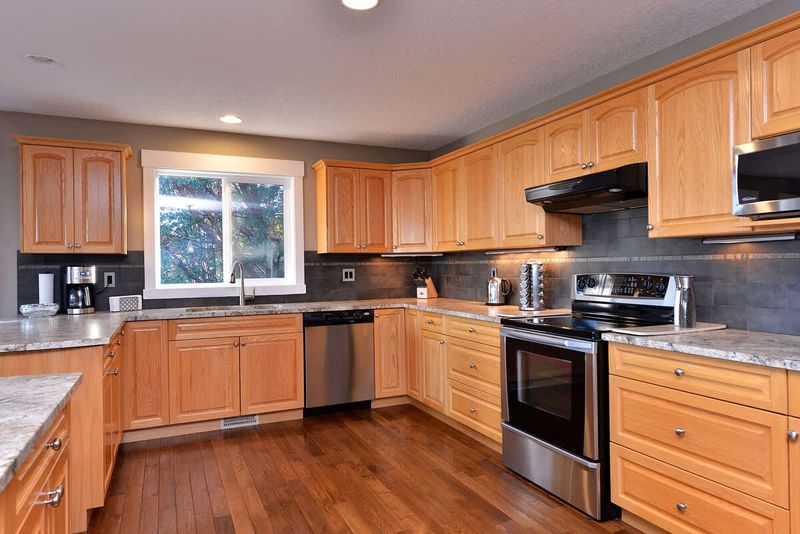 Large and fully equipped kitchen with granite counter tops and stainless steel appliances.