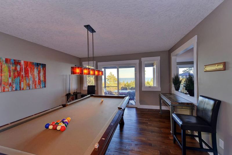 Large billiards room with access to the deck.