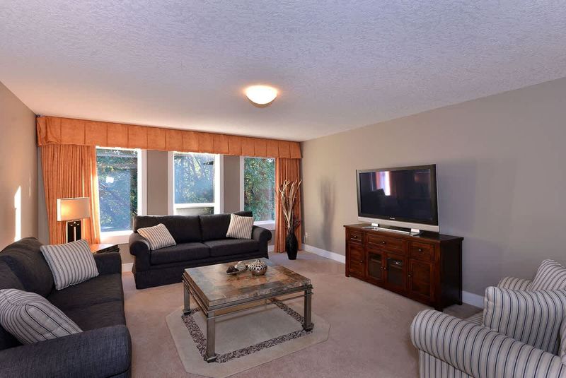 The family room, located off the front foyer is a cozy spot to read a book or enjoy some television.