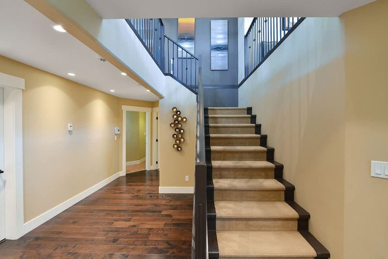 Main level staircase to the upper main level. 
