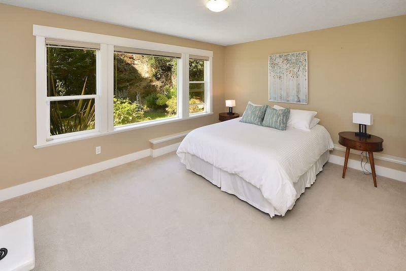 Main level 5th bedroom with Queen Bed.