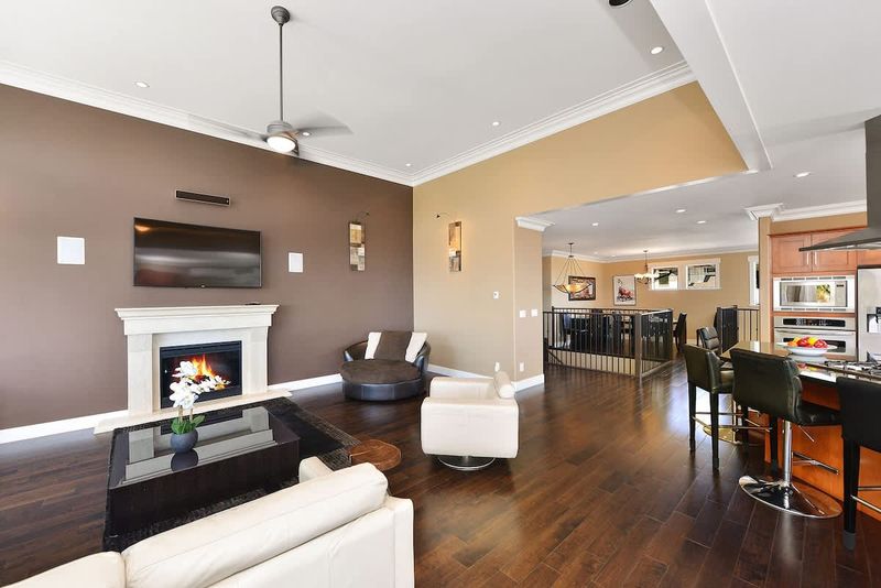 Upper main level living, kitchen, and dining space. 