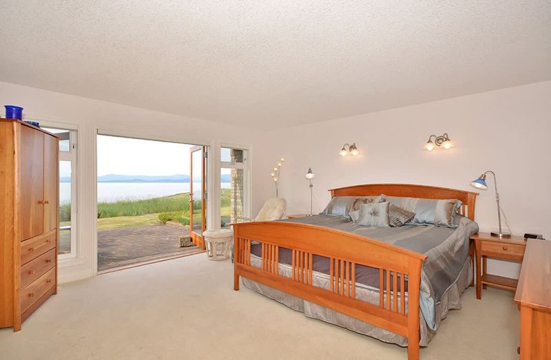 Master bedroom with king and a walk-in closet-sized bed