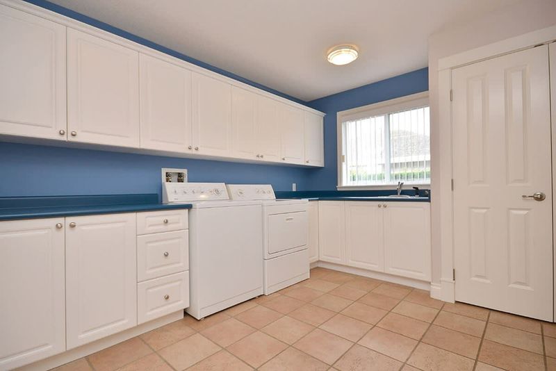 Enormous laundry room with tiled floors.