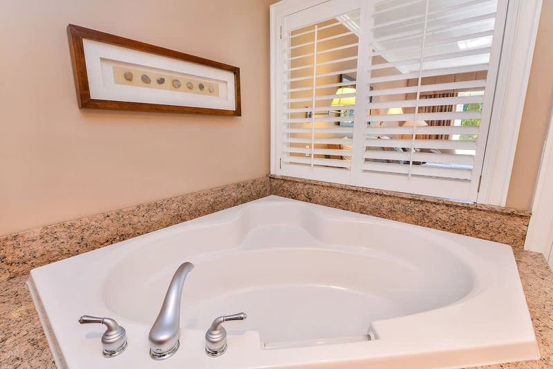 Large and spacious Master bathroom with walk in shower and soaker tub. 