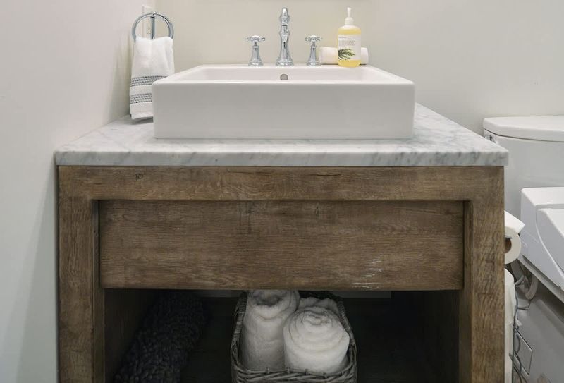 Second main level bathroom with walk in shower.