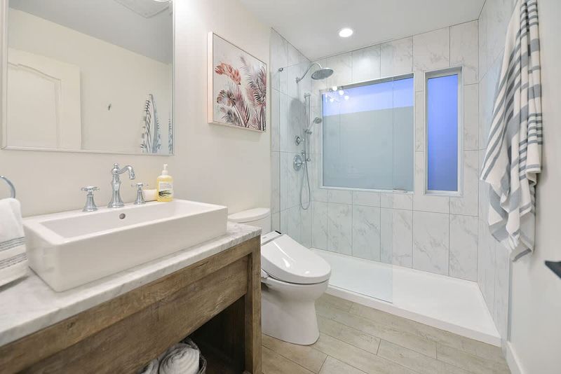 Second main level bathroom with walk in shower.