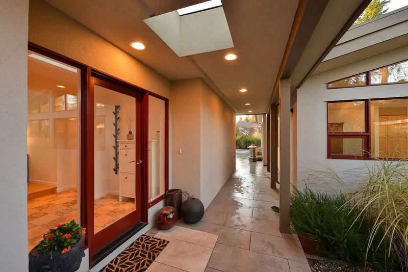 Breezeway to main entrance and office entrance.