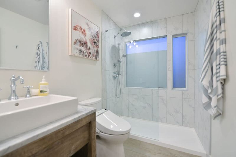 Second main level bathroom with walk in shower.