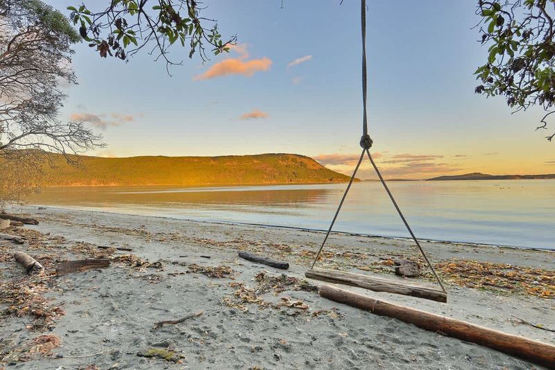 Sandy beach below the house.