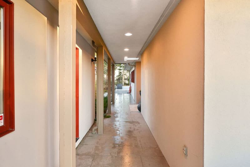 Breezeway to main entrance and office entrance.