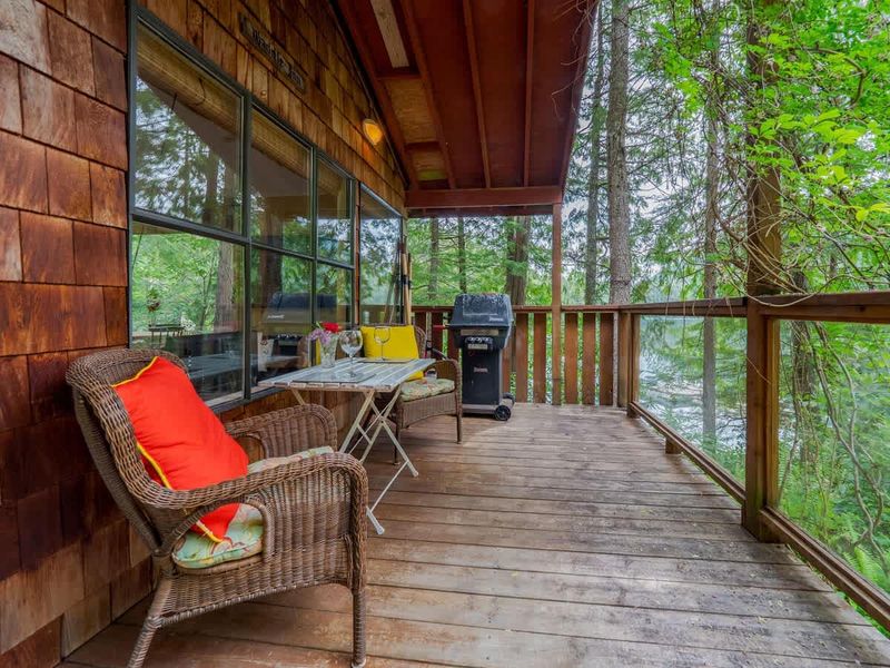 Outdoor patio space with BBQ grill. 