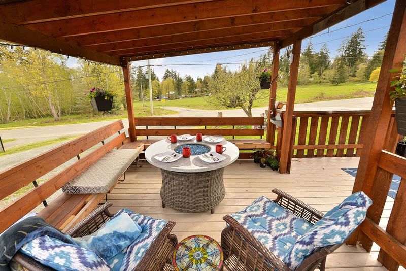 Spacious covered seating space on the deck with views.