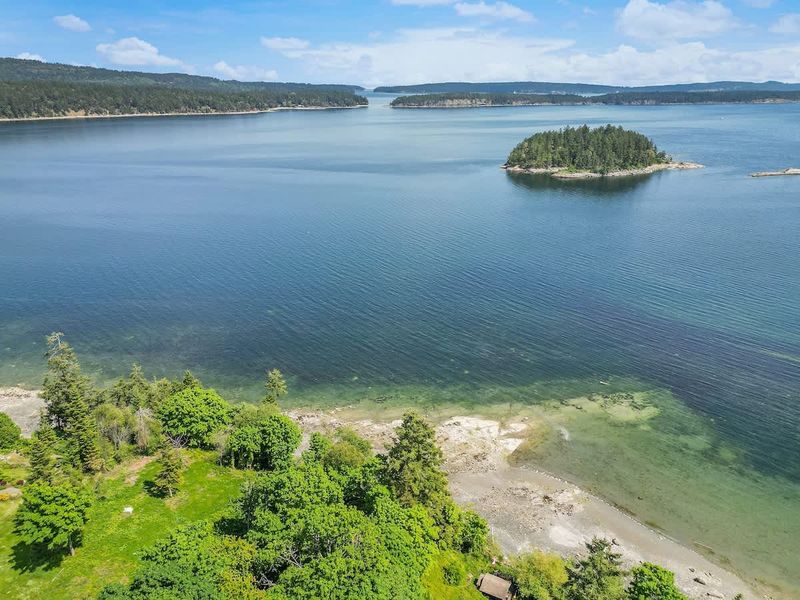 Drone aerial photo above the cottage facing the ocean.