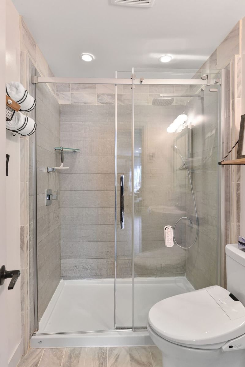 Main 3 piece bathroom with walk in shower.
