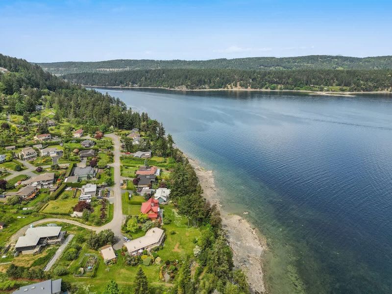 Drone aerial photo above the cottage facing the ocean.