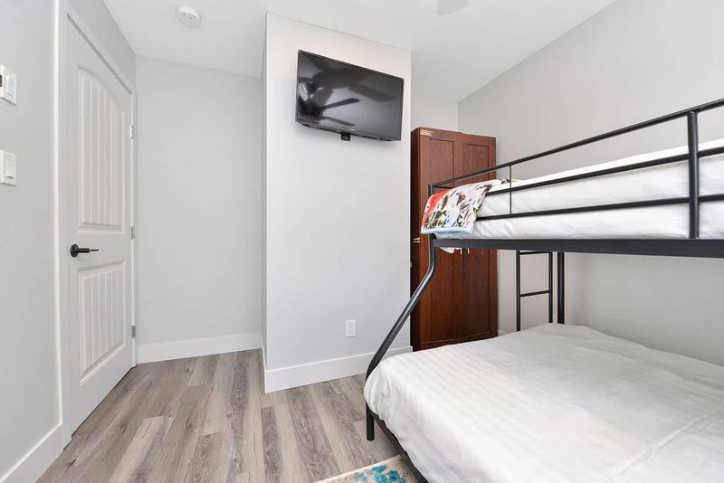 Second bedroom bunk beds with double and single up.