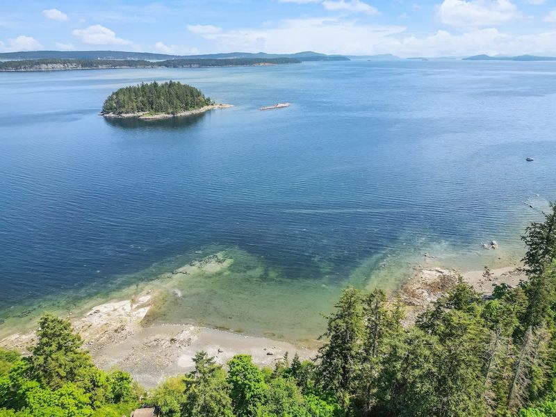 Drone aerial photo above the cottage facing the ocean.