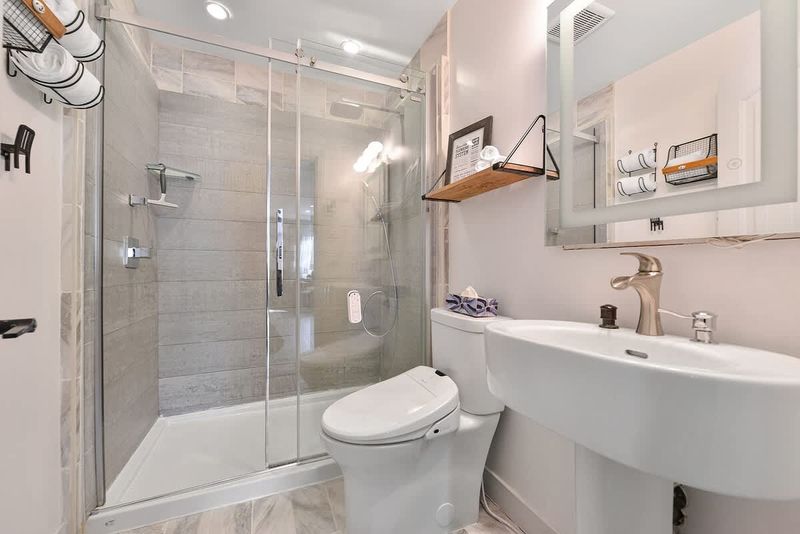 Main 3 piece bathroom with walk in shower.