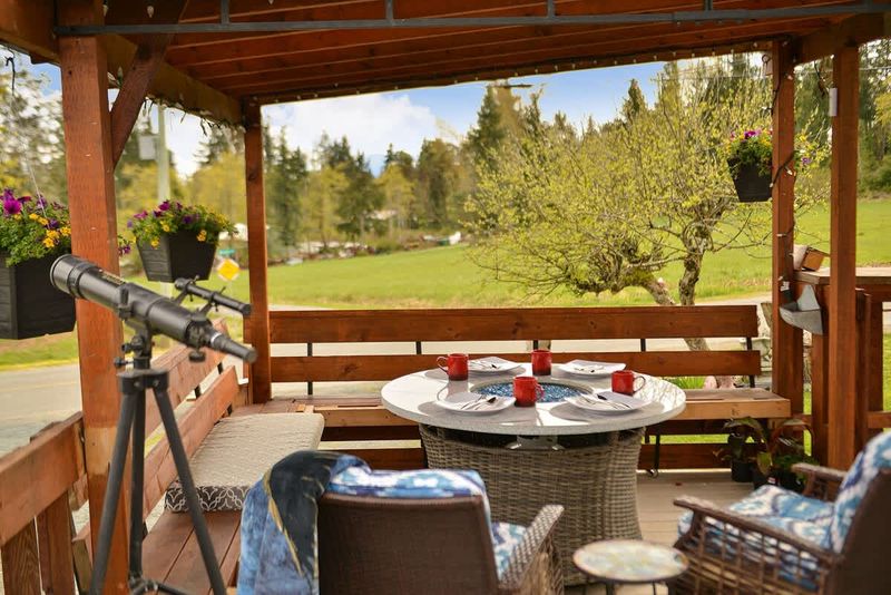 Spacious covered seating space on the deck with views.