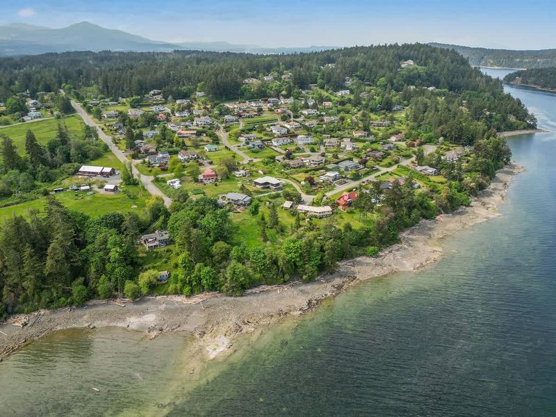 Drone aerial photo above the cottage facing the ocean.