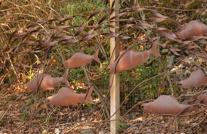 Main gates for the property showing ornate salmon metal work.
