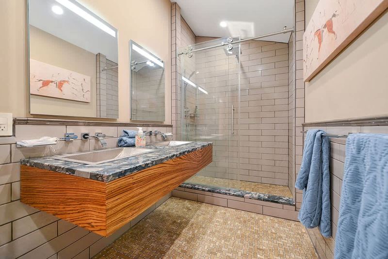 Dual sinks and walk in shower for the main bathroom.