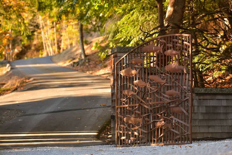 Main gates for the property showing ornate salmon metal work.