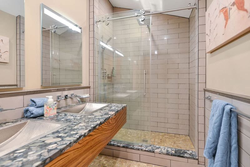 Dual sinks and walk in shower for the main bathroom.