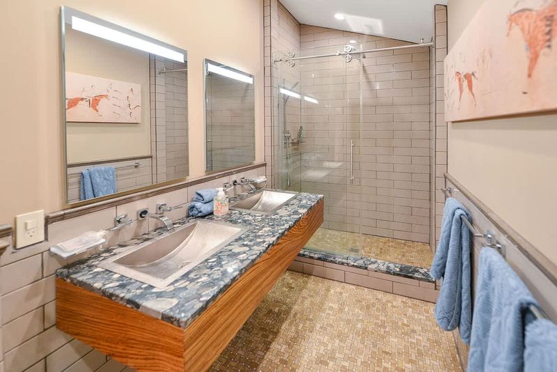 Dual sinks and walk in shower for the main bathroom.