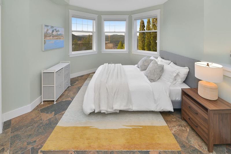 Lower floor sixth bedroom with queen bed.