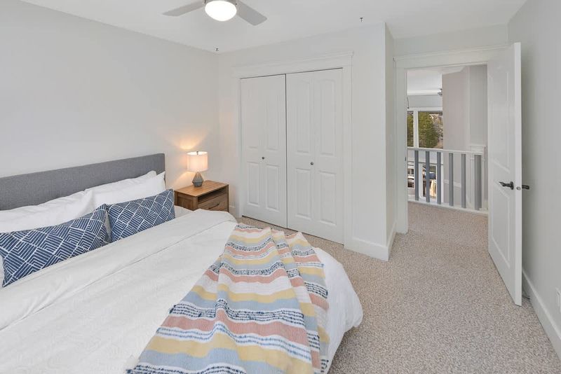 Top floor third bedroom with queen bed.