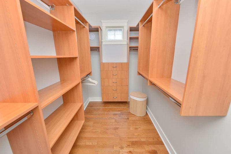 Primary bedroom on the main floor walk in closet.