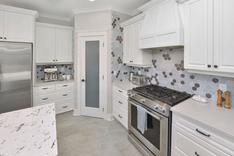 Fully equipped modern kitchen with amazing views on the main floor.