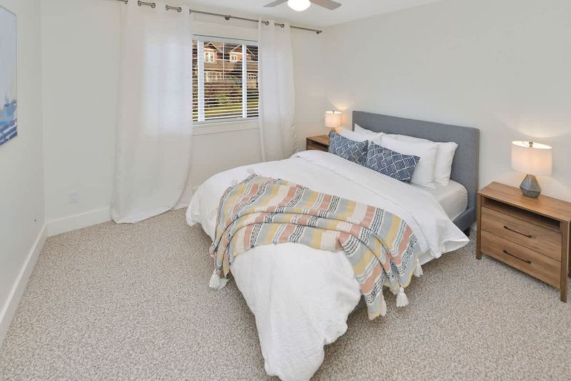 Top floor third bedroom with queen bed.