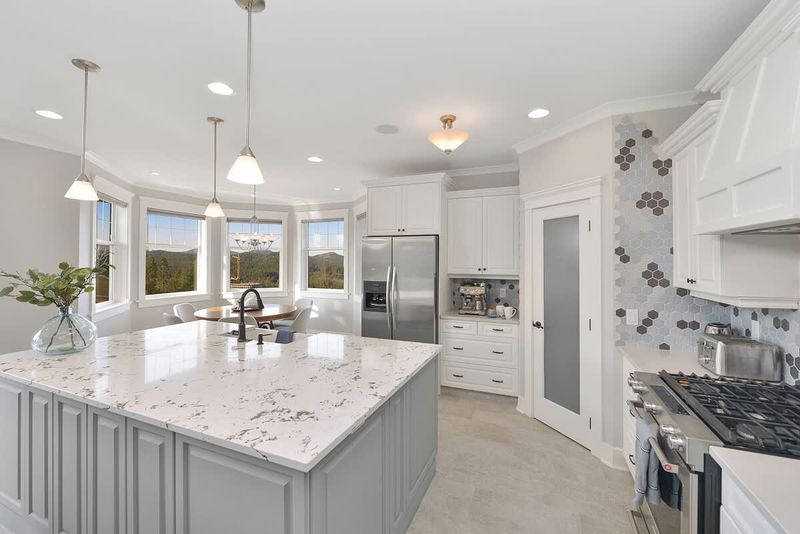 Fully equipped modern kitchen with amazing views on the main floor.