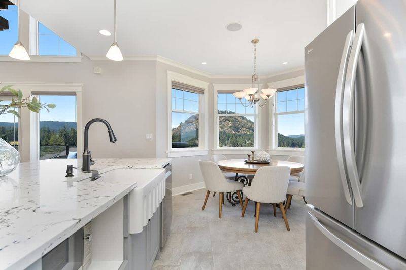 Fully equipped modern kitchen with amazing views on the main floor.