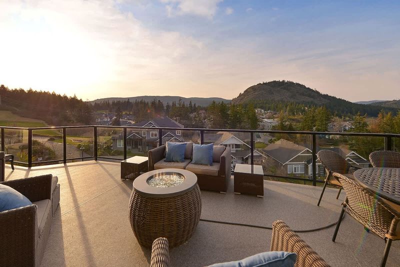 Main level decks with amazing views of the Bear Mountain Resort and Mount Finlayson.